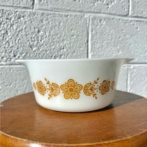 Pyrex 1.5-quart round casserole dish in the "Butterfly Gold" pattern